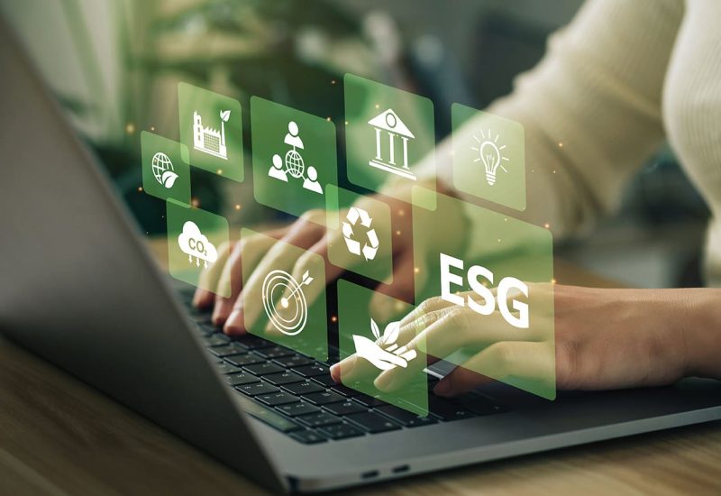 ESG environment social governance investment business concept. Women use a computer to analyze ESG, surrounded by ESG icons .close to the computer screen in business investment strategy concept.